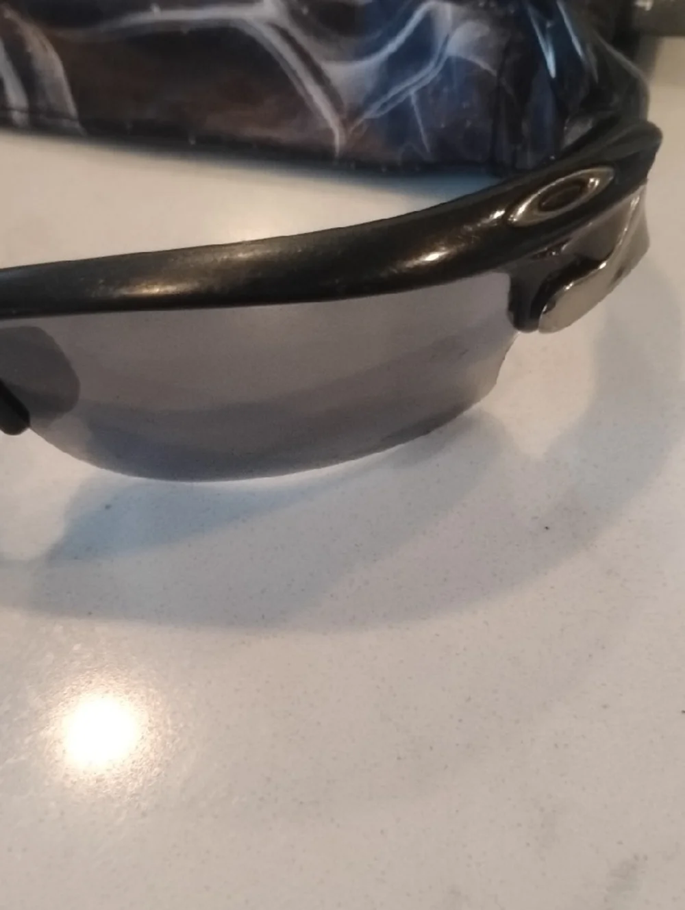 Oakley Black Frame Sunglasses with Gray And Orange Lenses